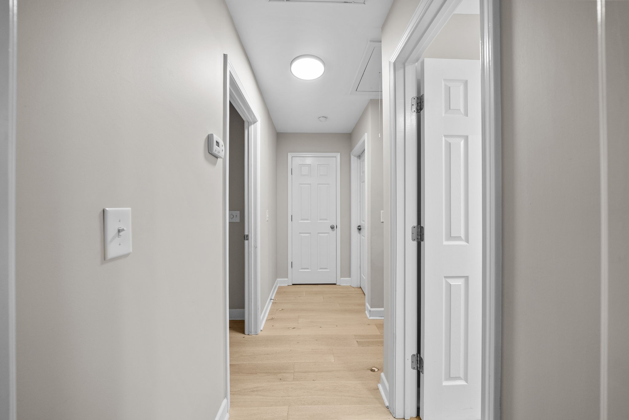 1161 Cynthia Lane Spring Hill, TN 37174 - Photo 24 of 42 a view of a hallway with wooden floor and a bathroom