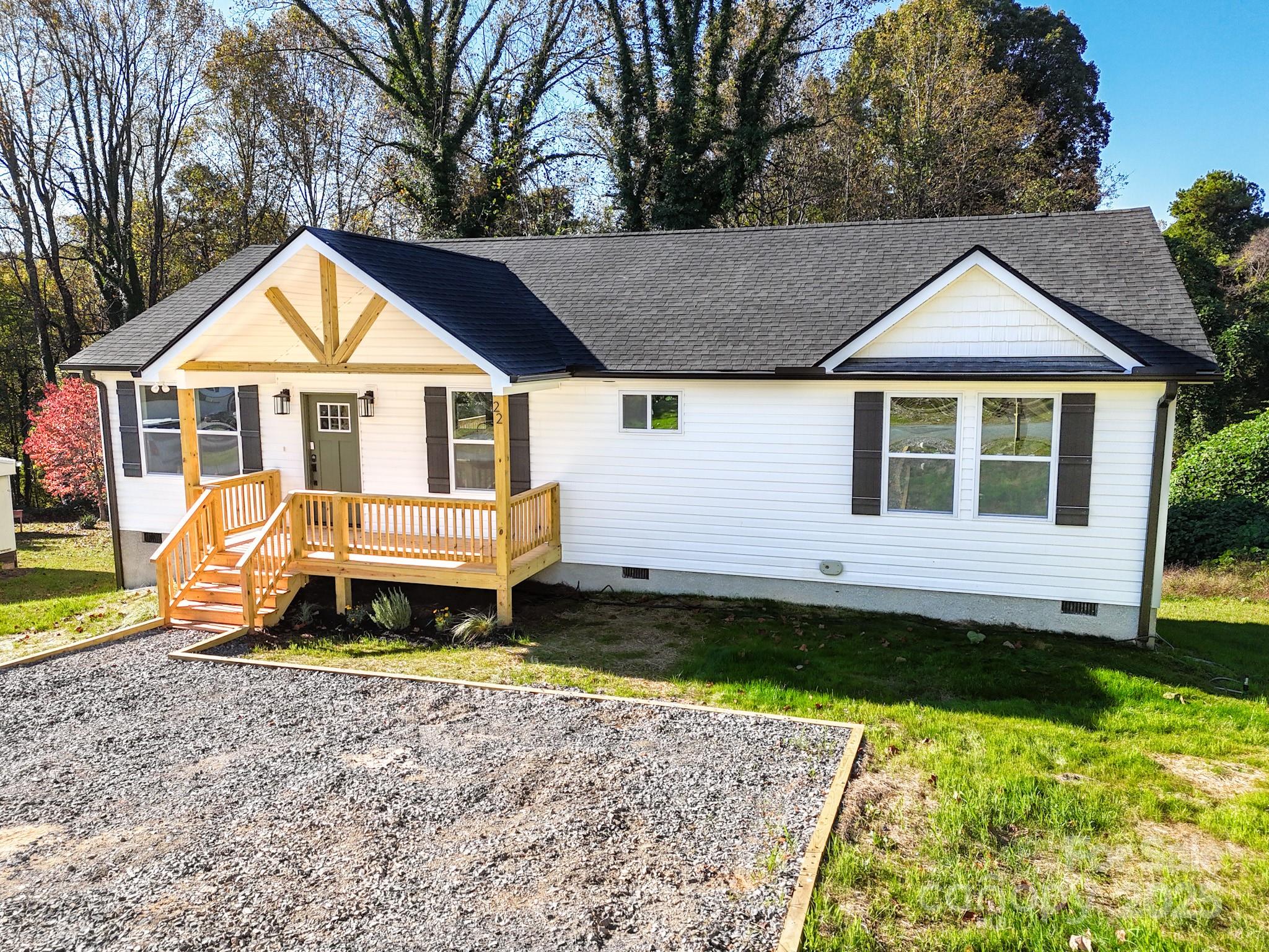 22 Hoyle Street Marion, NC 28752 - Photo 3 of 43 a view of a house with a yard and roof deck