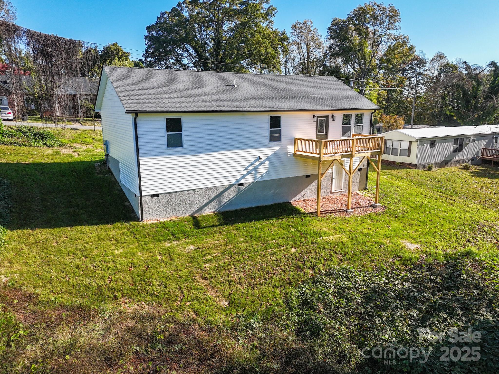 22 Hoyle Street Marion, NC 28752 - Photo 40 of 43 a view of a house with a yard patio and sitting area