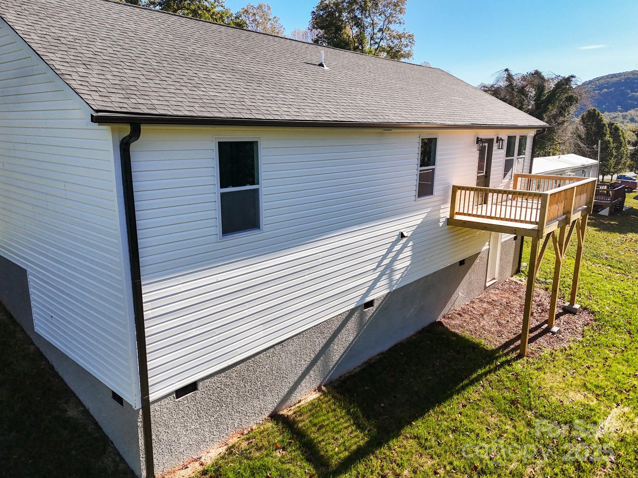 22 Hoyle Street Marion, NC 28752 - Photo 5 of 43 a view of a house with wooden deck