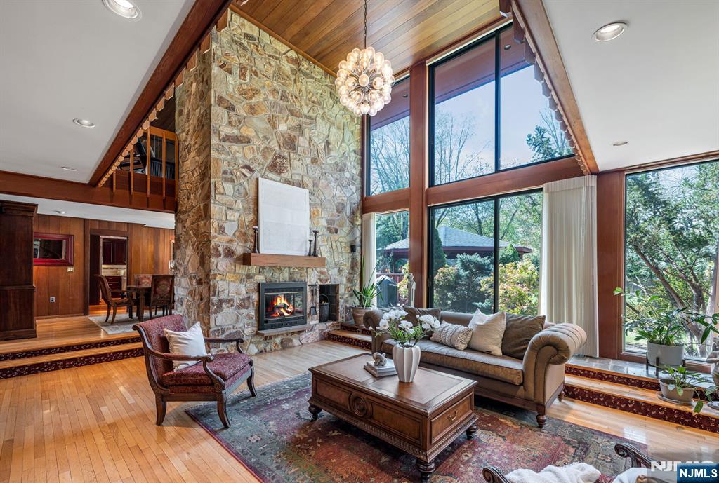 84 Bogerts Mill Road Harrington Park, NJ 07640 - Photo 6 of 47 a living room with fireplace furniture and a large window