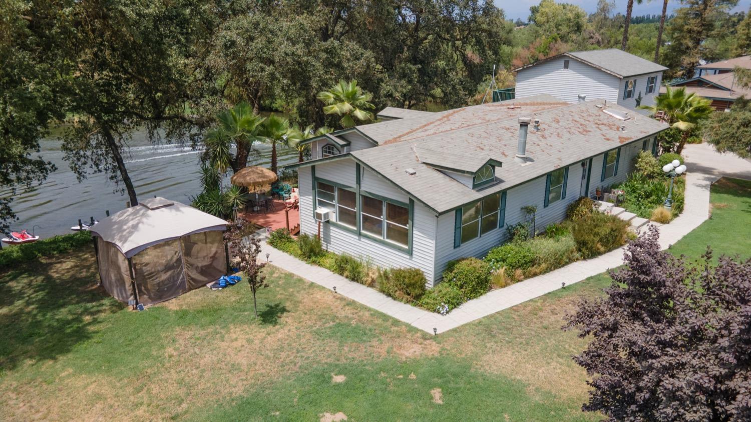 41261B Road 40 Reedley, CA 93654 - Photo 1 of 46 view of the home and Kings River in the background