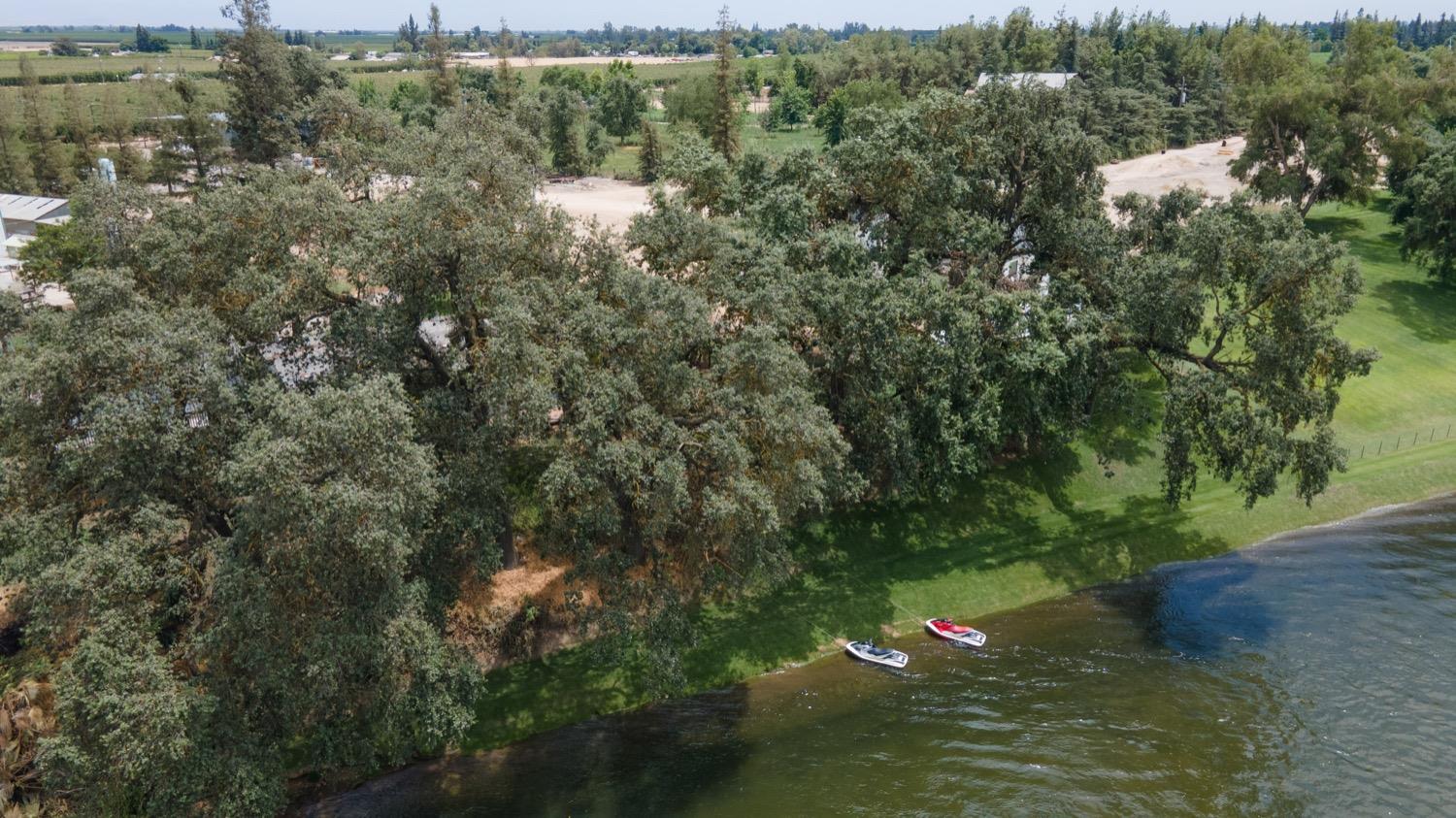 41261B Road 40 Reedley, CA 93654 - Photo 13 of 46 The jet ski's in this photo are parked behind the home down to the river
