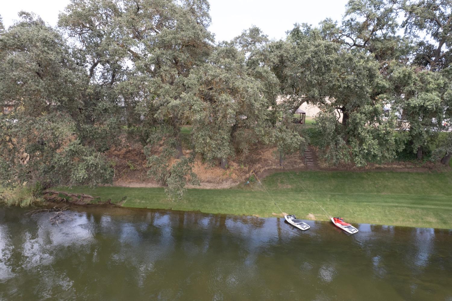 41261B Road 40 Reedley, CA 93654 - Photo 8 of 46 The Jet Ski's moored at the lawn area are behind the property.