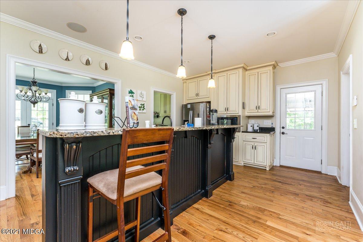 908 Jenkins Road Forsyth, GA 31029 - Photo 14 of 34 a kitchen with a sink appliances and cabinets