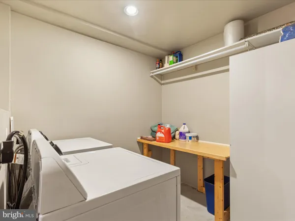 a view of a livingroom with furniture and a flat screen tv