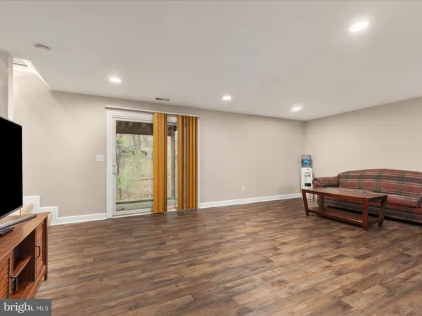 a room with furniture and a flat screen tv