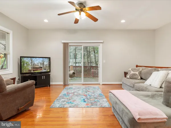a bedroom with a bed and glass window