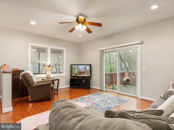 a bedroom with a bed and glass window