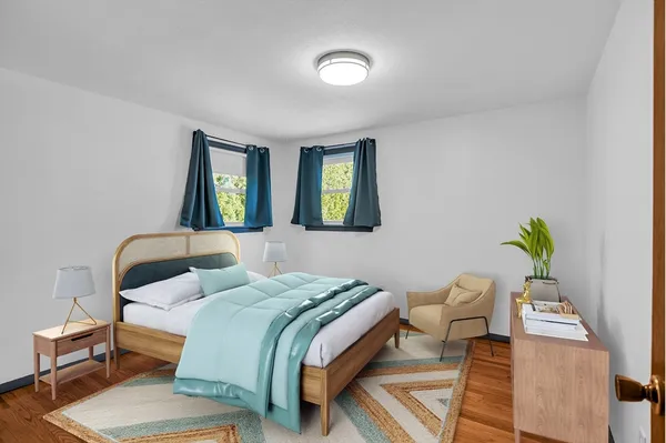 a bedroom with a bed and window