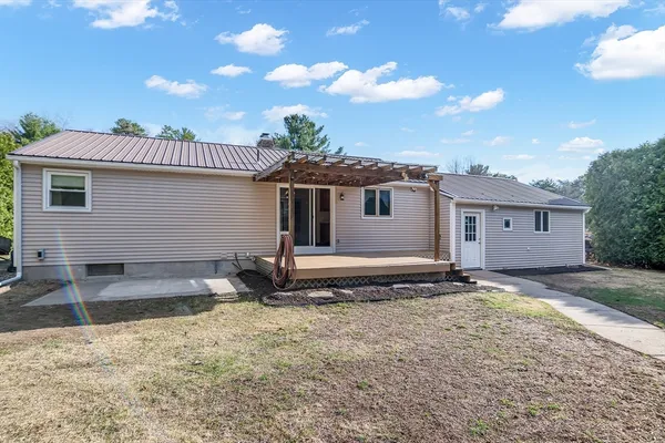 a view of backyard with cabin