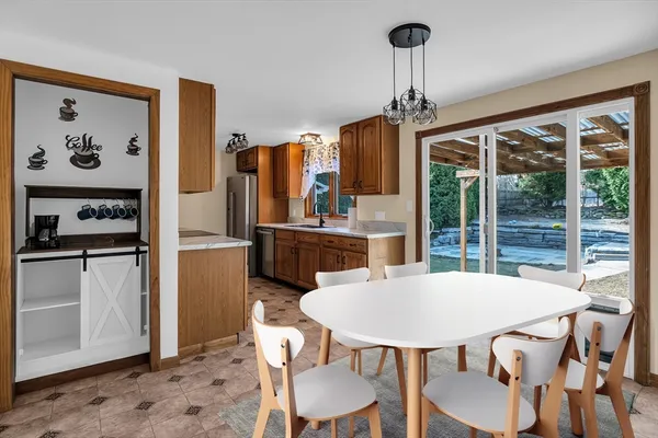 a view of a dining room with furniture window and outside view