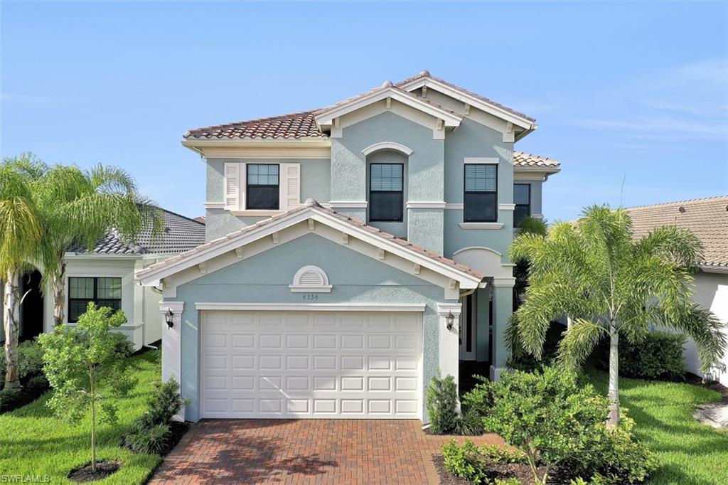 4334 Aurora Street Naples, FL 34119 - Photo 30 of 31 a front view of a house with a yard