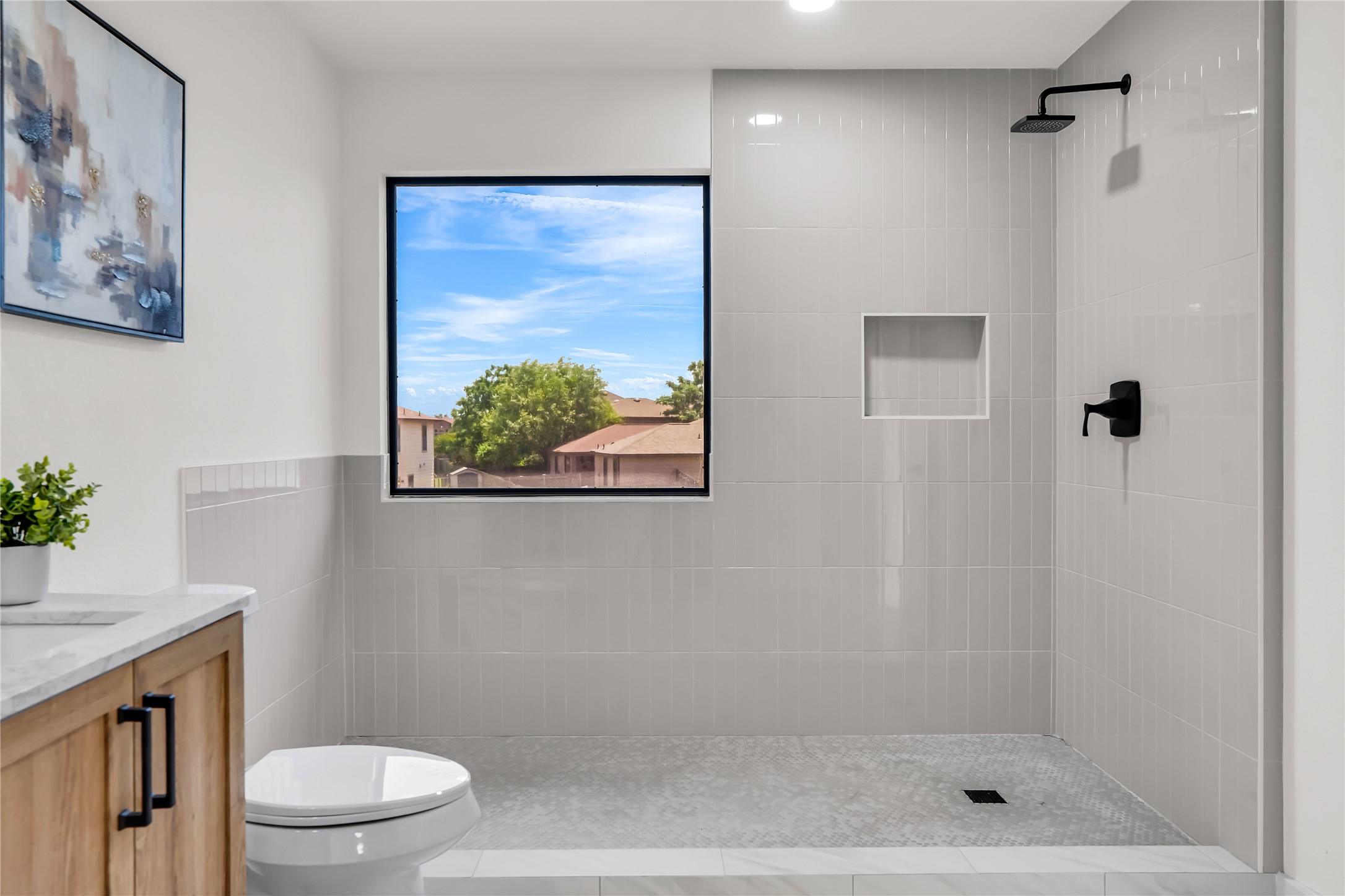 8921 Norwich Castle Austin, TX 78747 - Photo 20 of 33 a bathroom with a shower a toilet and a shower