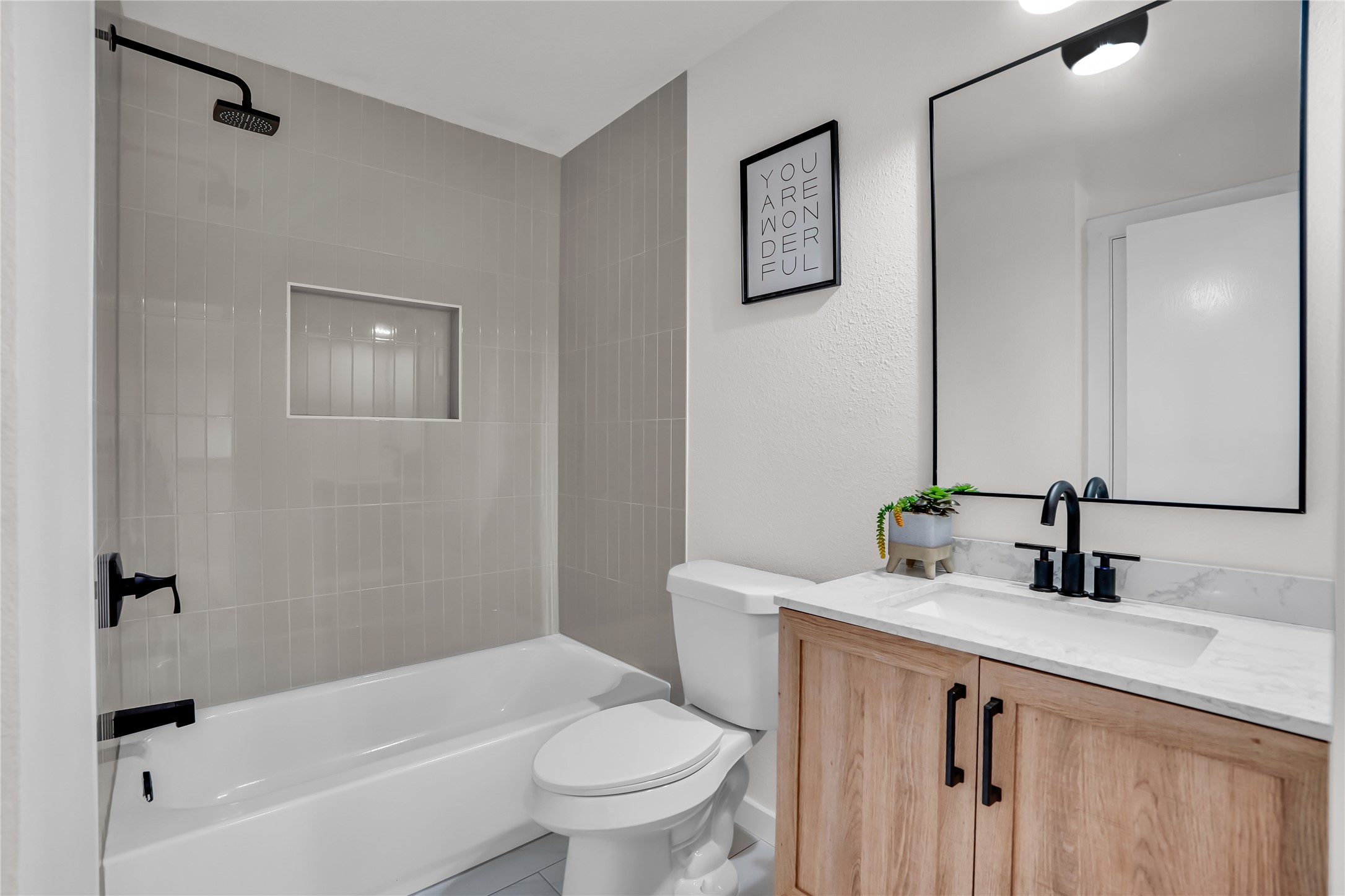8921 Norwich Castle Austin, TX 78747 - Photo 23 of 33 a bathroom with a sink a toilet and shower