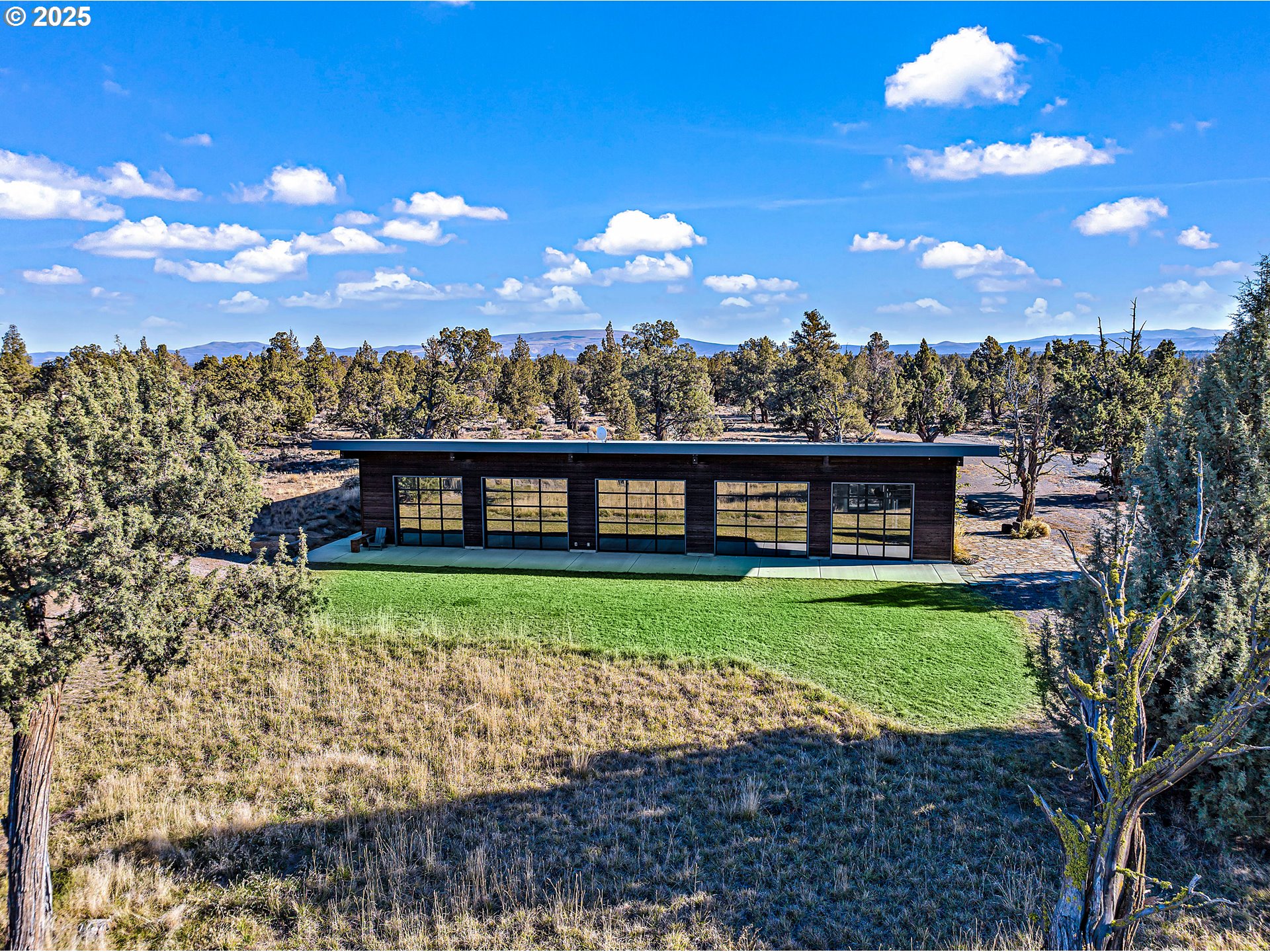 62265 Dodds Road Bend, OR 97701 - Photo 11 of 47 a view of a big yard with an ocean view