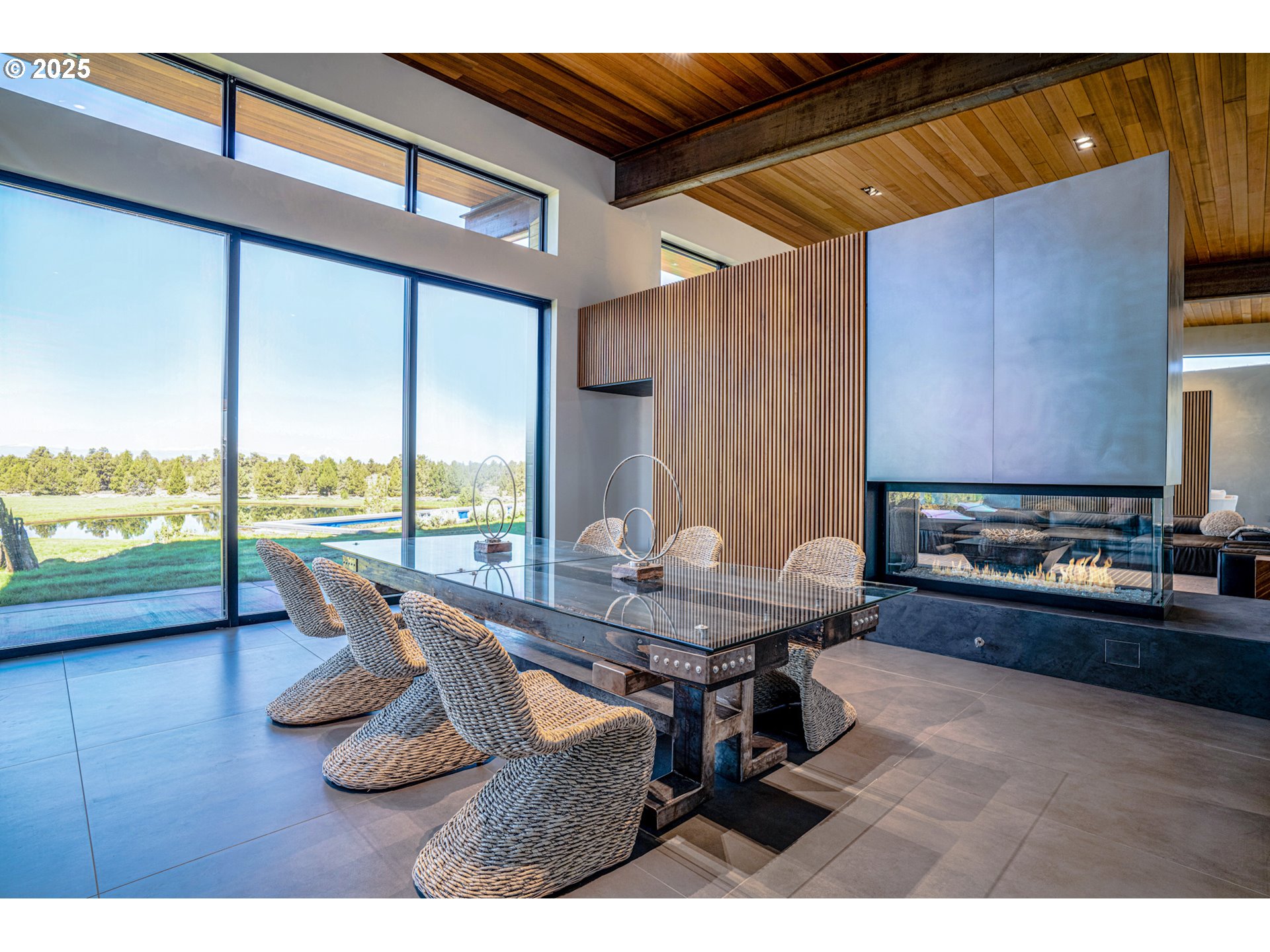 62265 Dodds Road Bend, OR 97701 - Photo 20 of 47 a dining room with furniture and a floor to ceiling window