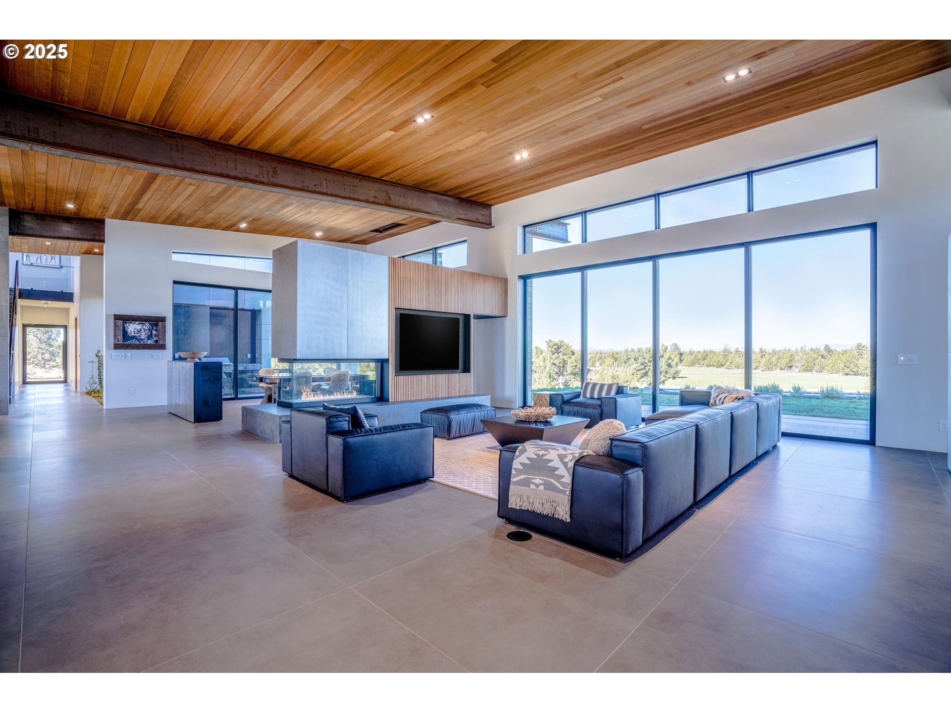 62265 Dodds Road Bend, OR 97701 - Photo 21 of 47 a living room with furniture and a flat screen tv