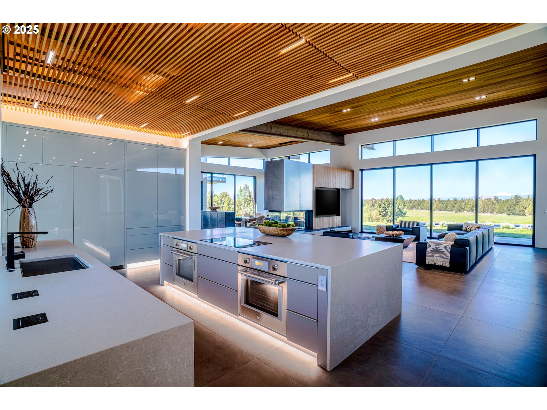 62265 Dodds Road Bend, OR 97701 - Photo 26 of 47 a living room with furniture and a large window