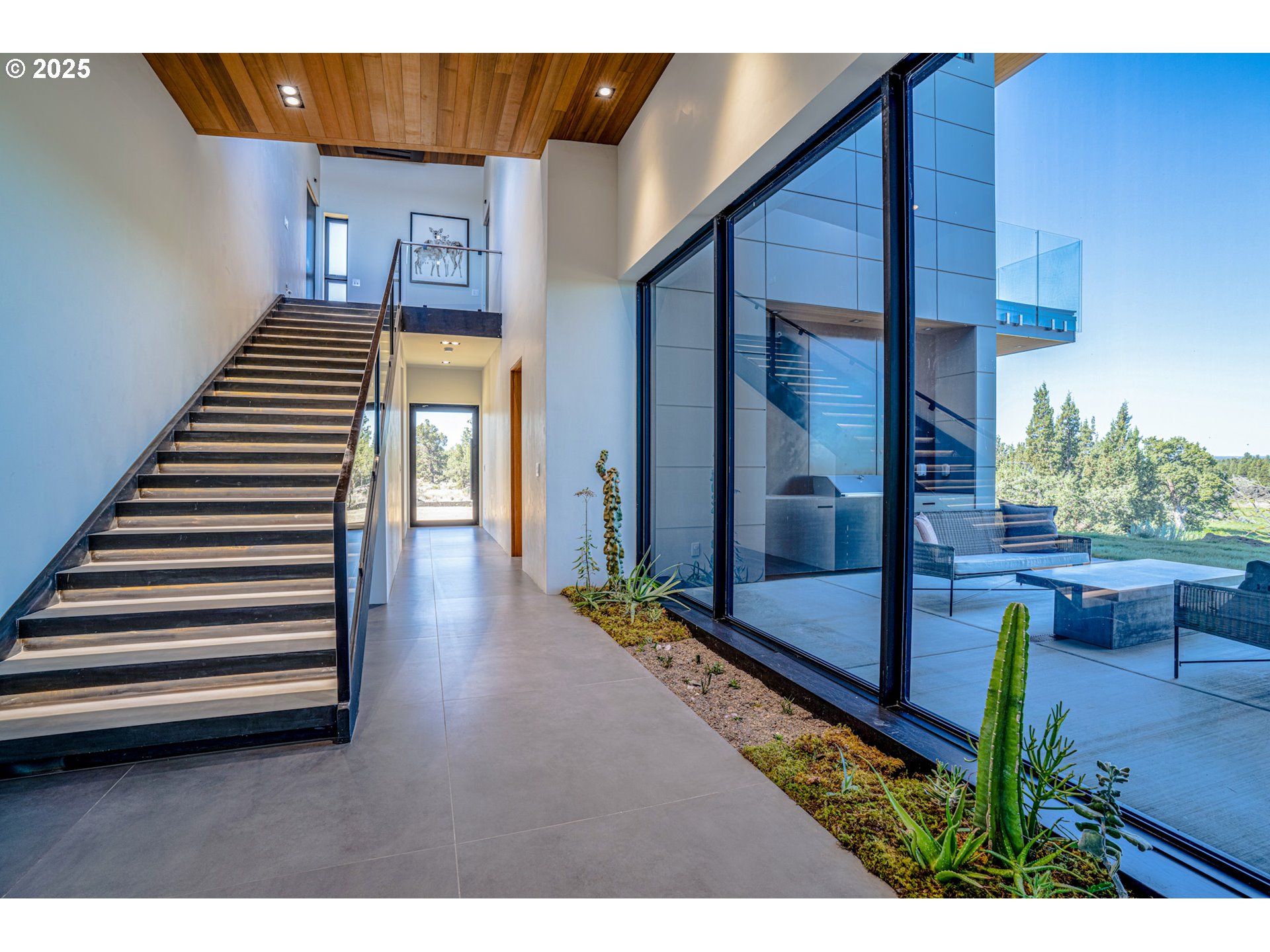 62265 Dodds Road Bend, OR 97701 - Photo 31 of 47 a view of a balcony with chairs and wooden floor