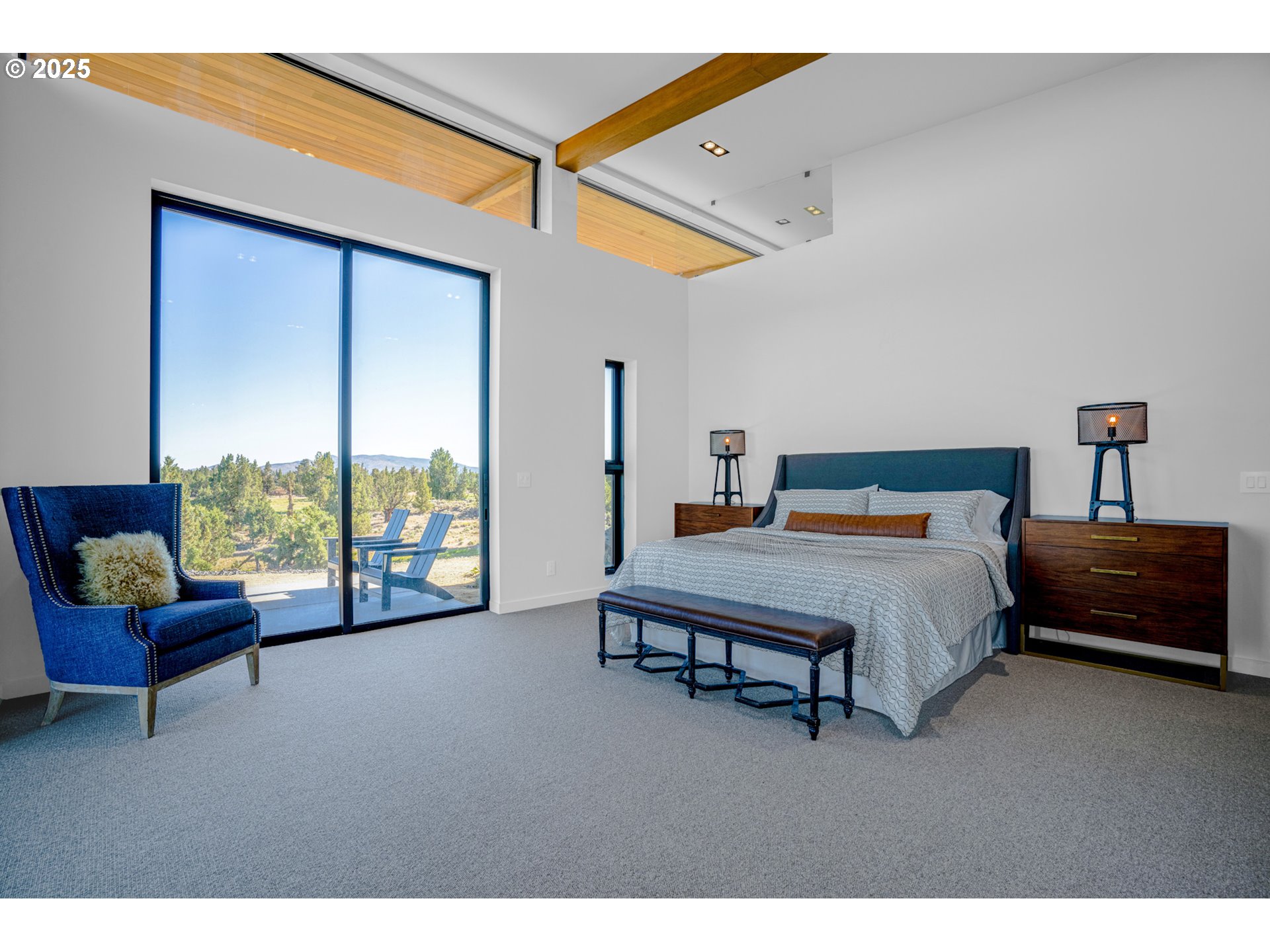 62265 Dodds Road Bend, OR 97701 - Photo 37 of 47 a bedroom with a bed a couch and a window