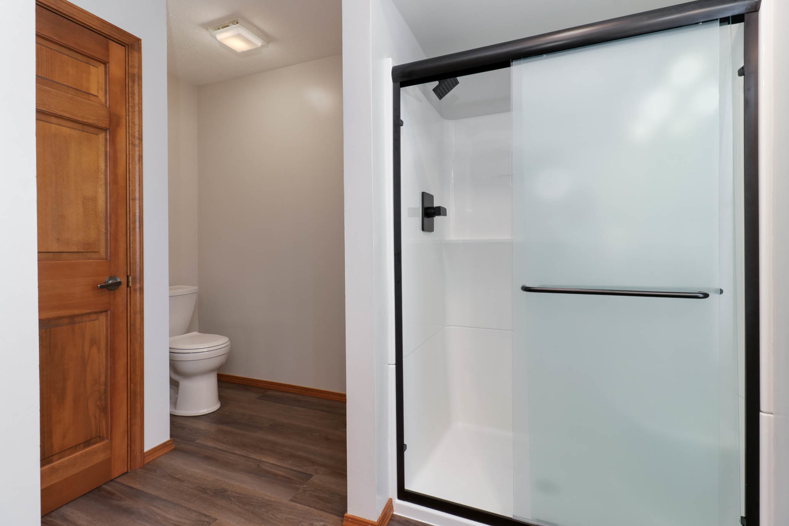 3203 Eagle Crest Road Bloomington, IL 61704 - Photo 22 of 52 a bathroom with a glass shower door