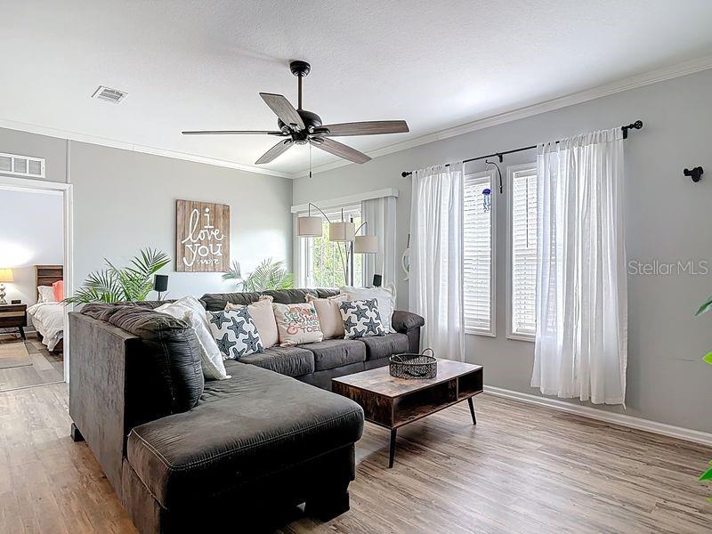 102 Ash Street Edgewater, FL 32141 - Photo 14 of 36 a living room with furniture and a window