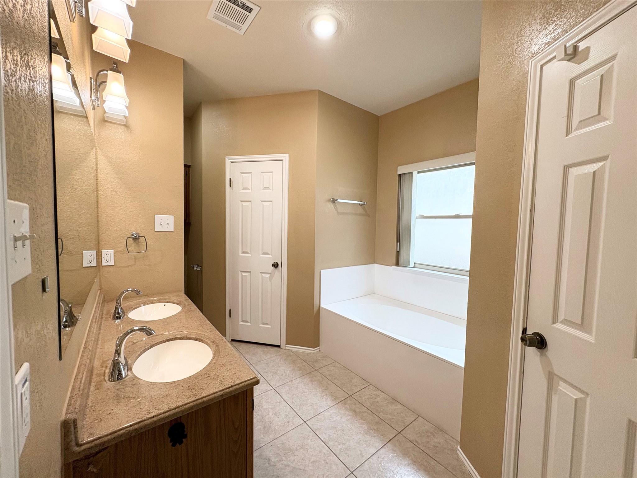 8103 Ephraim Road Austin, TX 78717 - Photo 32 of 35 Twin basin vanity with ample counter space enhances daily routines in this well-appointed bathroom.