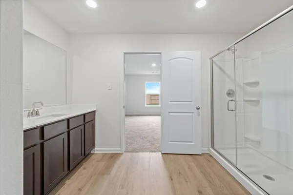 a bathroom with a sink and shower