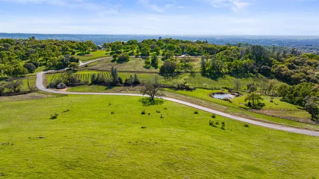 a view of a swimming pool with a yard