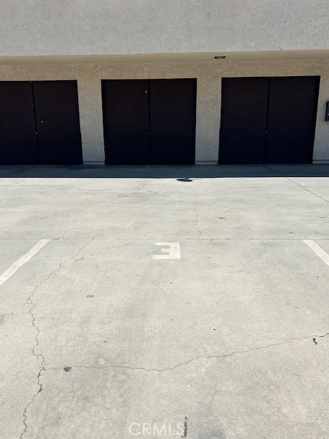 7304 Exeter Street, Unit E Paramount, CA 90723 - Photo 30 of 36 This home offers one detached garage space plus one assigned uncovered parking space, both conveniently located next to one another for easy access.