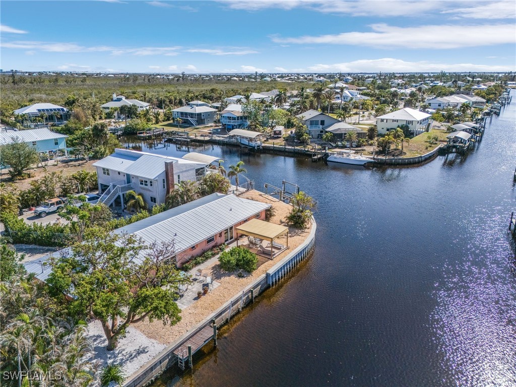 an aerial view of a house with a lake view