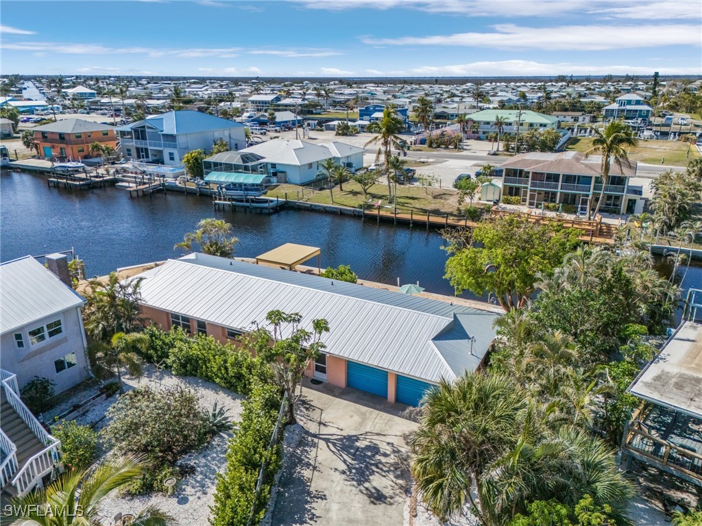 3201-3203 Stabile Road St. James City, FL 33956 - Photo 2 of 34 an aerial view of a house with a lake view