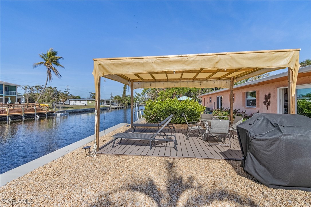 3201-3203 Stabile Road St. James City, FL 33956 - Photo 30 of 34 a view of a swimming pool with a patio