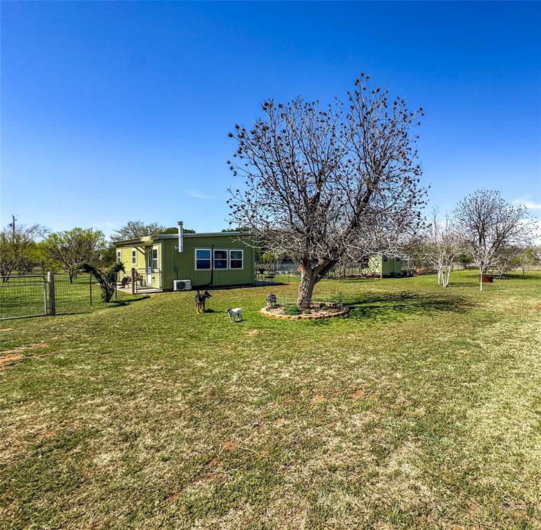 1209 Taylor Avenue Rule, TX 79547 - Photo 25 of 40 a view of outdoor space with garden and trees