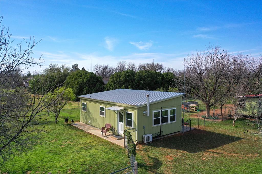 1209 Taylor Avenue Rule, TX 79547 - Photo 32 of 40 a view of a house with a yard