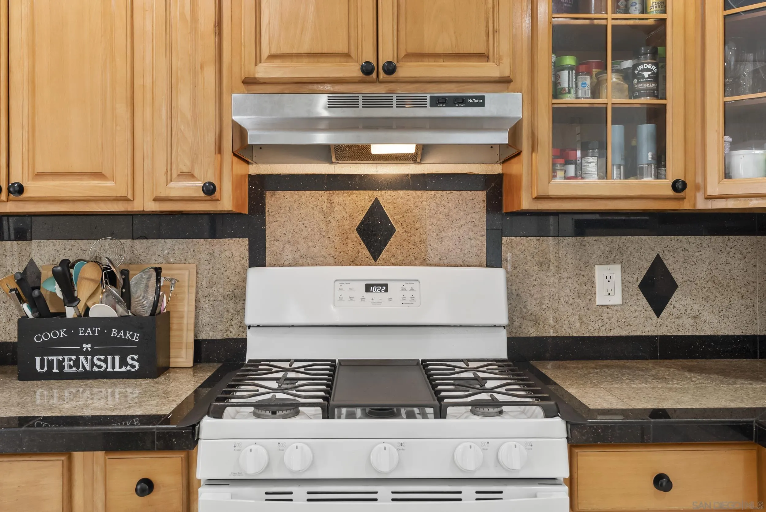 3746 Harding Avenue San Diego, CA 92113 - Photo 17 of 35 a stove top oven sitting inside of a kitchen