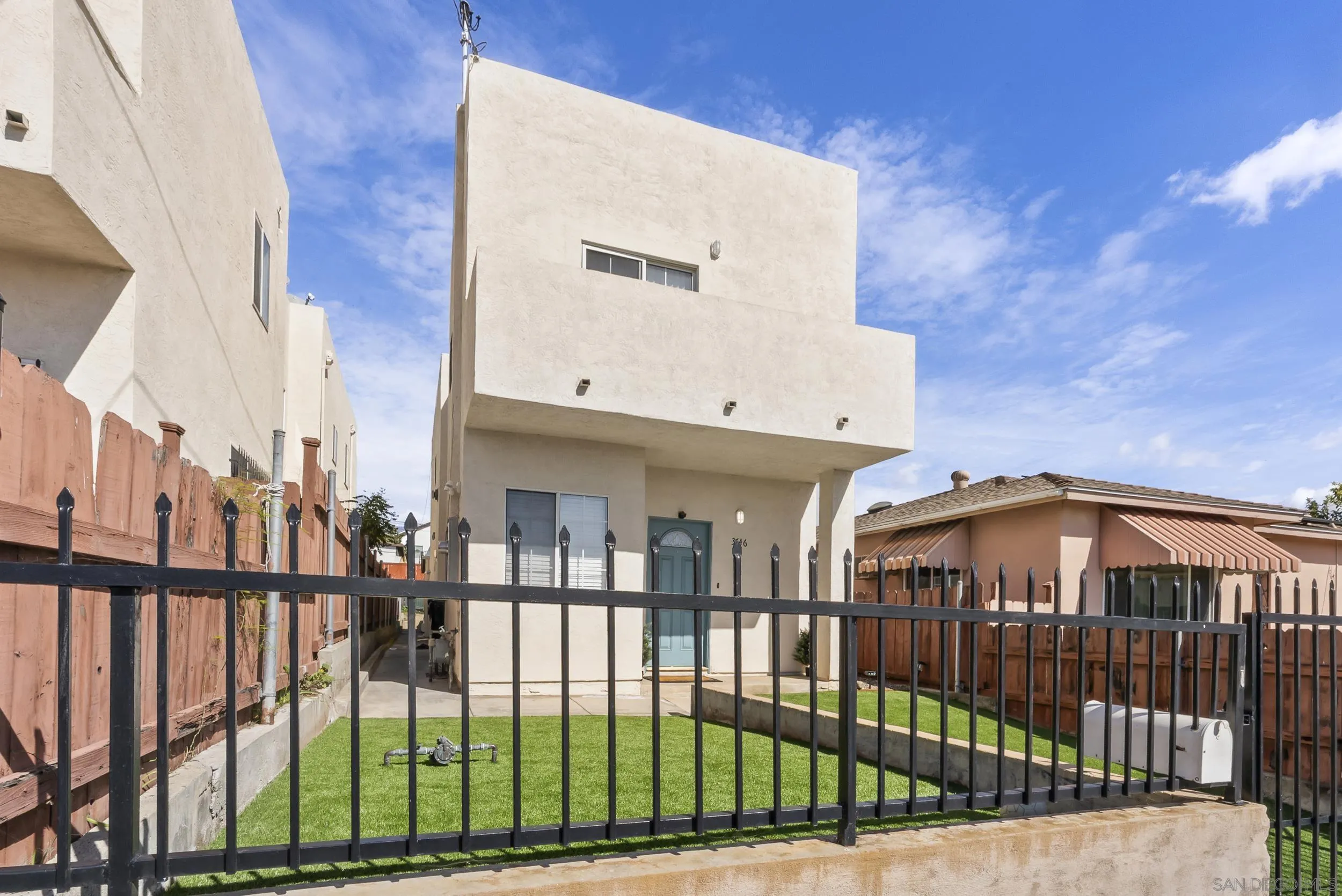 3746 Harding Avenue San Diego, CA 92113 - Photo 2 of 35 a view of a brick building from a balcony