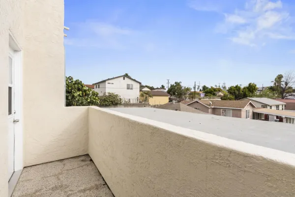 a view of a balcony with an outdoor space