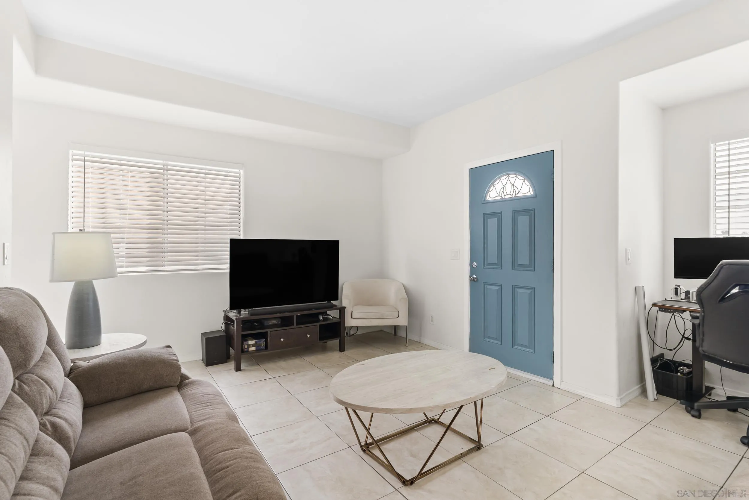 3746 Harding Avenue San Diego, CA 92113 - Photo 6 of 35 a living room with furniture and a flat screen tv