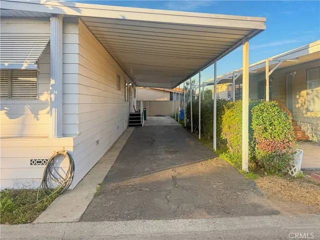 a view of a pathway with a patio
