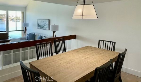 27793 Rota, Unit 14 Mission Viejo, CA 92692 - Photo 12 of 18 a view of a dining room with furniture and wooden floor