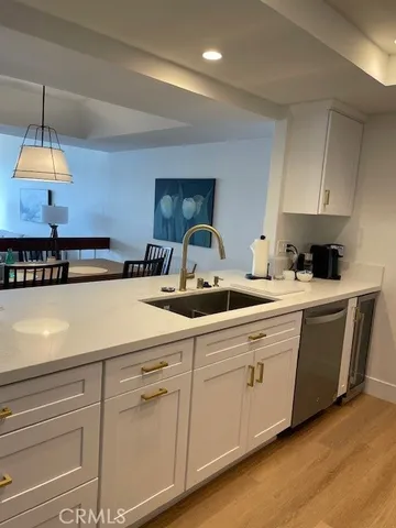 a kitchen with sink cabinets and window