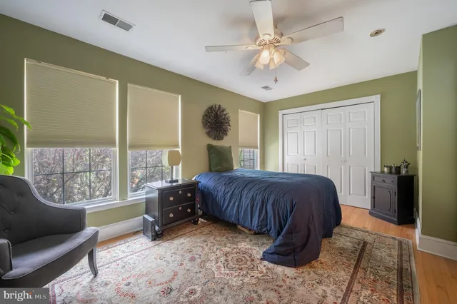 a bedroom with a large bed and a couch