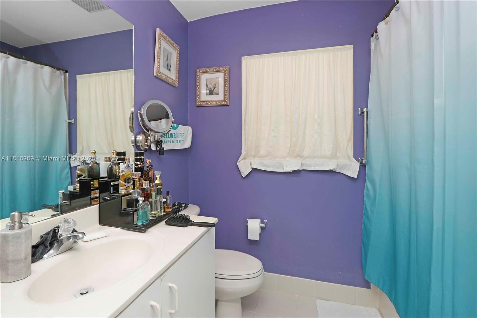 1585 Southeast 20th Road Homestead, FL 33035 - Photo 11 of 26 a bathroom with a sink mirror vanity and toilet