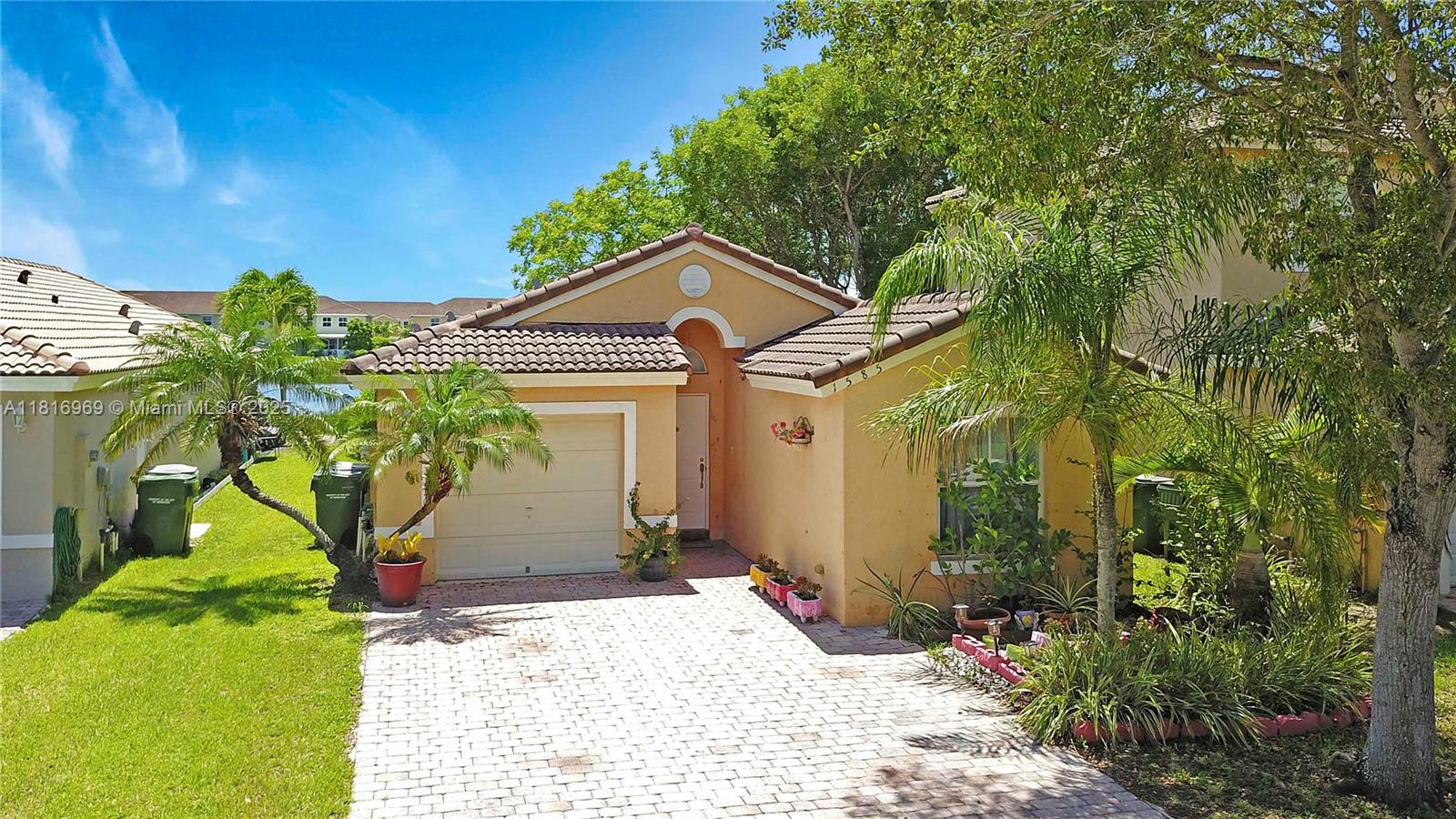1585 Southeast 20th Road Homestead, FL 33035 - Photo 19 of 26 a front view of a house with a yard