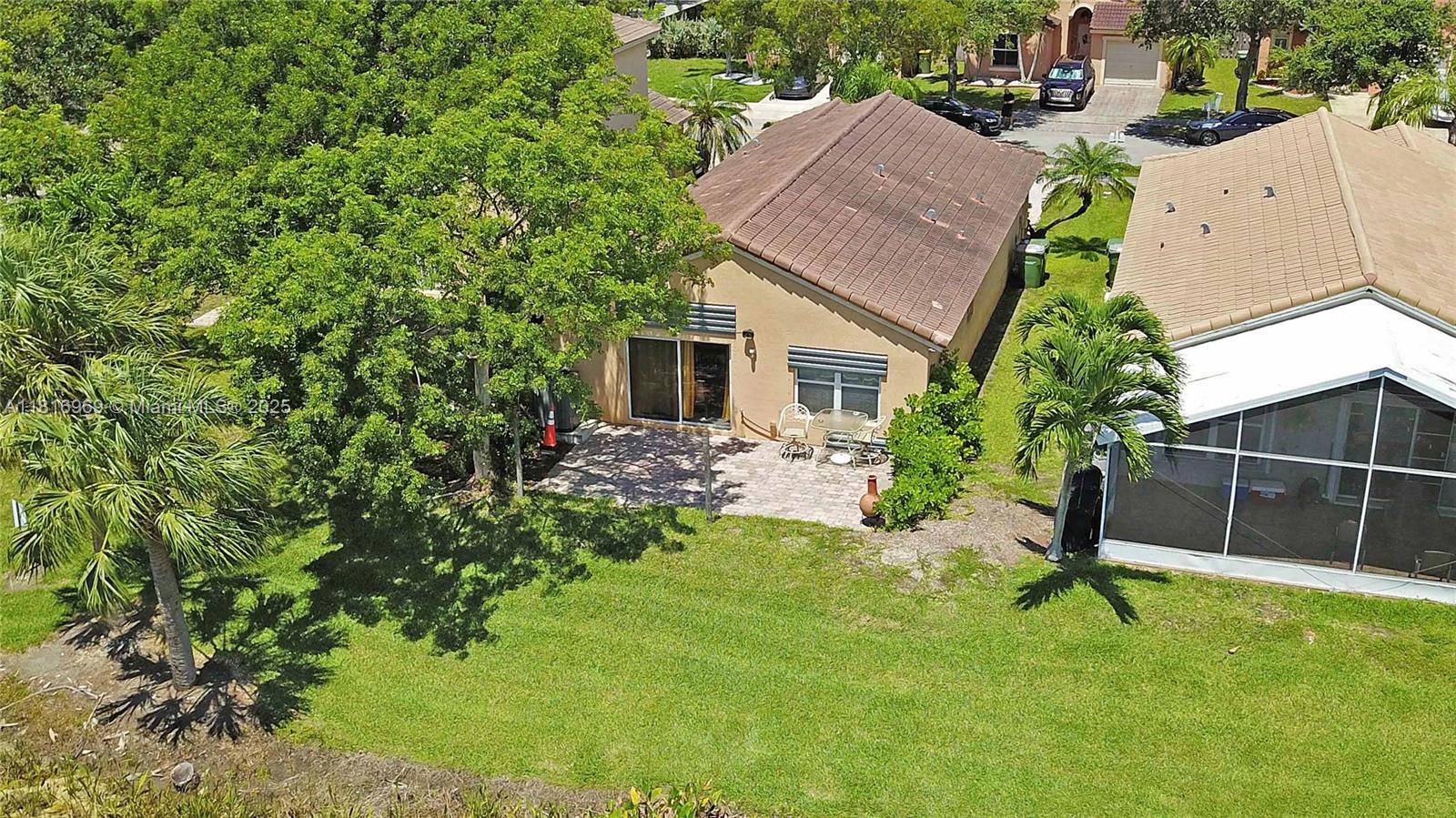 1585 Southeast 20th Road Homestead, FL 33035 - Photo 20 of 26 a house view with a garden space