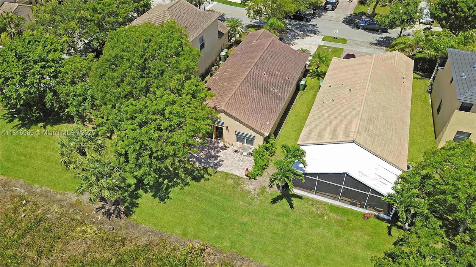 1585 Southeast 20th Road Homestead, FL 33035 - Photo 21 of 26 an aerial view of a house with swimming pool and garden