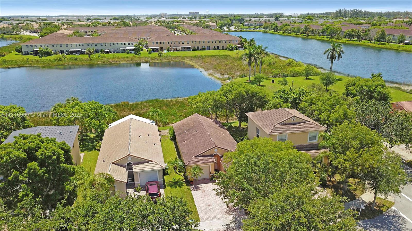 1585 Southeast 20th Road Homestead, FL 33035 - Photo 25 of 26 an aerial view of a house with outdoor space and lake view