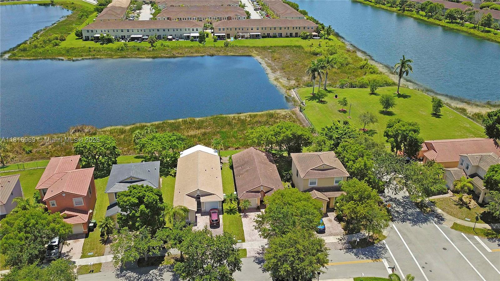 1585 Southeast 20th Road Homestead, FL 33035 - Photo 26 of 26 an aerial view of a house with a garden and lake view